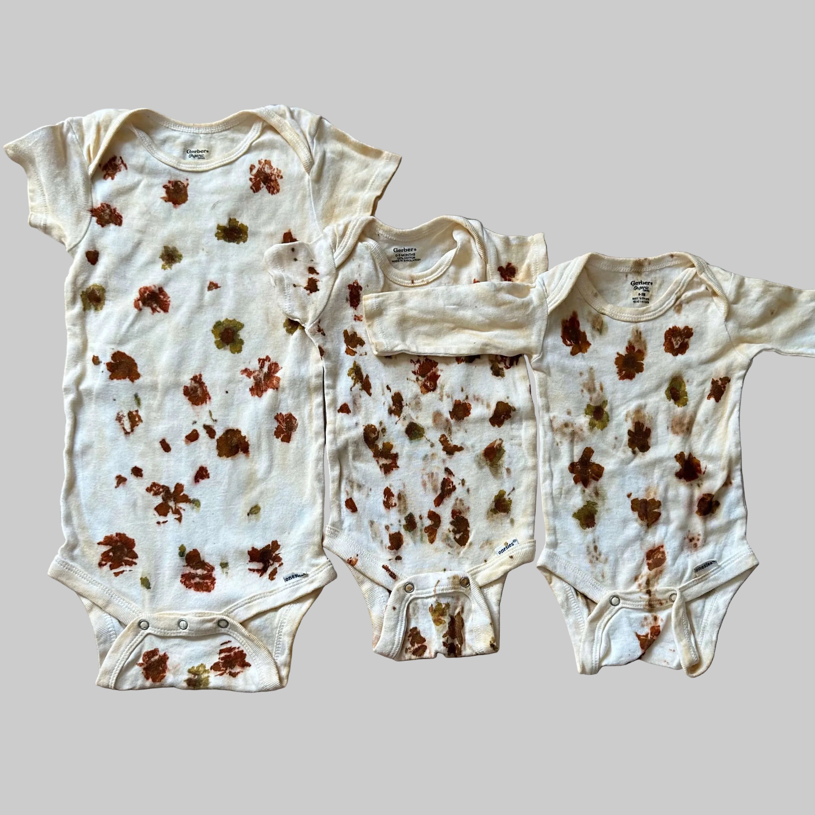 Baby Onsies Dyed With Marigolds and Coreopsis and Weld